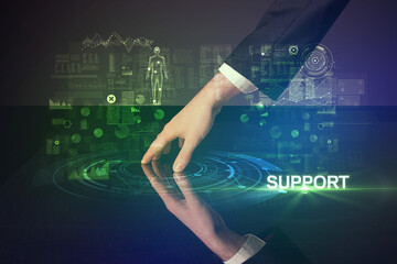Businessman touching huge display with SUPPORT inscription, modern technology concept