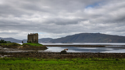 Stalker Castle on a tidal islet on Loch Laich, Argyll, Scotland, United Kingdom