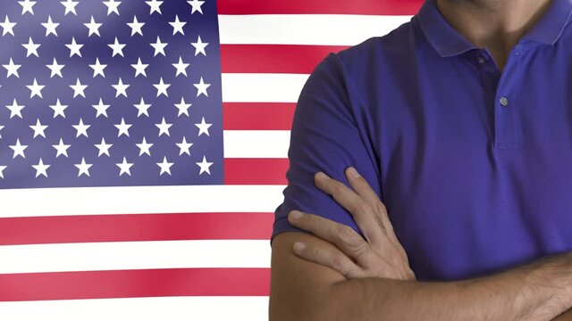 Torso of a man Young man with arms crossed against composite image of 3d digitally generated united states national flag