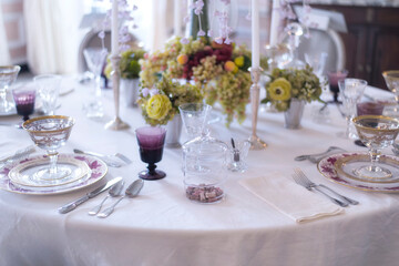 A holiday table set for dinner with fine china