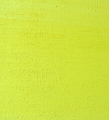  close-up surface of plywood painted yellow ,    surface of an untreated rough wooden board     