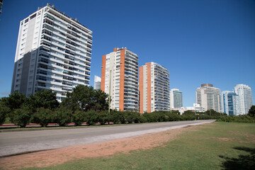 Fototapeta na wymiar View of residential buildings on beach avenue. Rambla Williman. Punta del Este, Maldonado, Uruguay
