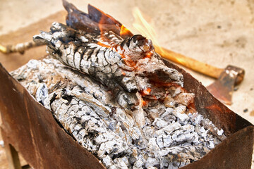 fire in the grill on the street for barbecue .coals, burning wood