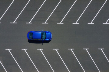 Transportation. View on the car from the air. Car in an empty parking lot. View of the vehicle from...