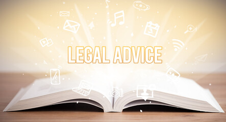 Opeen book with LEGAL ADVICE inscription, business concept