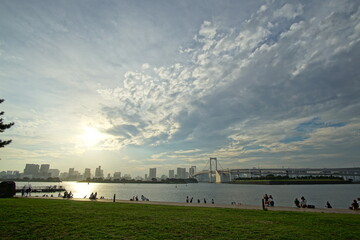 landscape of Odaiba rainbow bridge and cloudy sky, Tokyo, Japan 