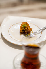 Turkish Dessert Kalburabasti / Sekerpare with Traditional Tea.