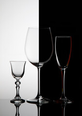 
Three glass goblets on black and white background