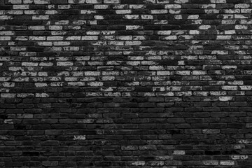 Fototapeta na wymiar Black brick building wall. Interior of a modern loft. Background for design