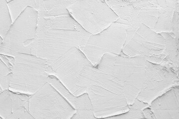 White wall of the building. Rough plaster surface. Abstract background.