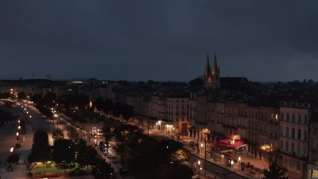 Bordeaux at Night with view of Saint-Louis-des-Chartrons Church, slow establishing Aerial
