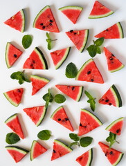 Food background with watermelon slices and mint leaves. Healthy natural food rich in vitamins.Watermelon is a popular organic farming product.