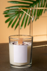 soy candle made with your own hands, with natural natural stones and minerals. On a bright pink background. High quality photo