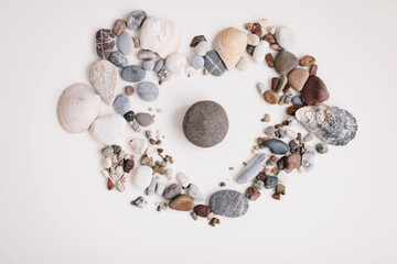 Soap with seashells and stones on a white background. Spa or wellness setting. Top view mockup