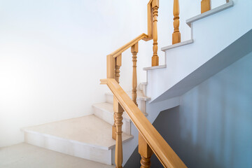 Contemporary stairway with wood handrail. Interior stairs. Staircase going up. Pathway of stairway or staircase inside a house. Interior structure design concept.