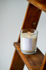 Elegant home decoration with wooden wick burning candle from soy wax. High quality photo