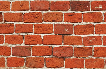 Old brick wall. Grunge background. Wall of red weathered bricks