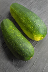 Fresh homemade vegetables lie on a black background