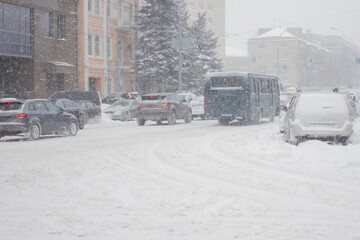 The winter city street road in heavy snowy storm.