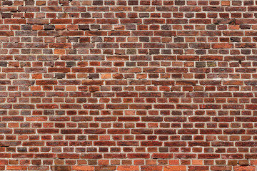Fototapeta na wymiar Old weathered red brick stone wall