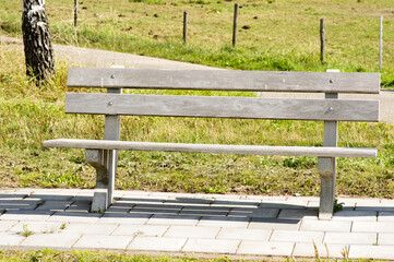 Brown wooden bench outdoors  in Arnhem, Netherlands