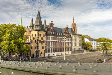 Fototapeta premium Frankfurt / Main, Germany - September 03rd 2020: Visiting the river front of Frankfurt / Main at a cloudy day in summer, view on a historical building next to the so called Römerberg.