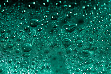 Abstract green bokeh texture on green background