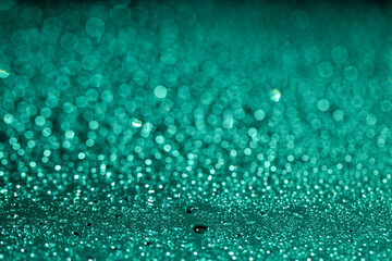 Abstract green bokeh texture on green background