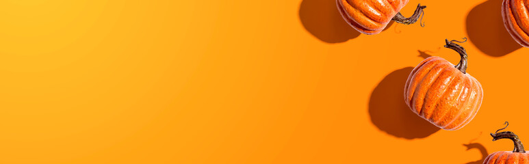 Autumn orange pumpkins overhead view - flat lay
