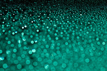 Abstract green bokeh texture on green background