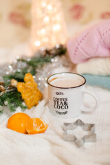 Hot chocolate with marshmallows and cinnamon, notepad, Christmas decorations on a light background. Christmas inspiration planning concept.