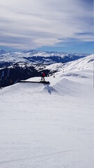 Skiing in the beautiful mountains of the Laax ski resort in Flims, Switzerland