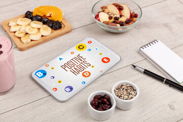 Healthy Tablet Pc compostion with POSITIVE HABITS inscription, weight loss concept