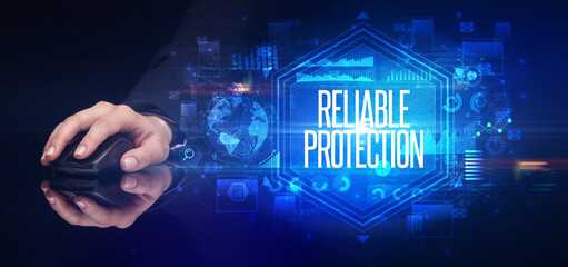 hand holding wireless peripheral with RELIABLE PROTECTION inscription, cyber security concept