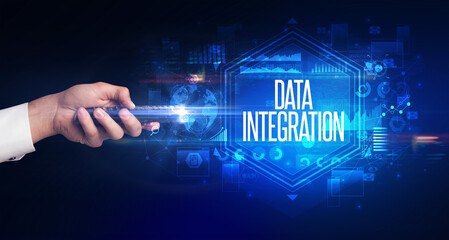 hand holding wireless peripheral with DATA INTEGRATION inscription, cyber security concept