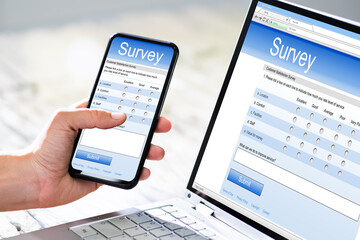 Close-up Of A Businesswoman Hand Filling Online Survey