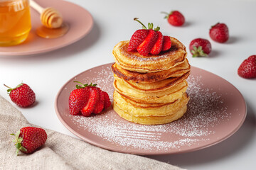 Delicious, only baked pancakes with fresh aromatic strawberries
