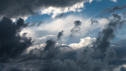 Naklejka na ściany i meble Stormy Clouds Moving Across the Threatening Summer Sky