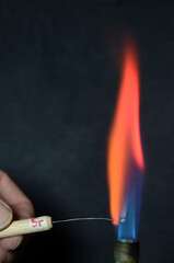 Colored fire caused by an element. Strontium causes a red color.