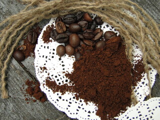 a pile of ground coffee beans on a round white napkin.