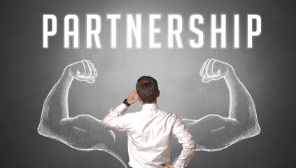 Rear view of a businessman with PARTNERSHIP inscription, powerfull business concept