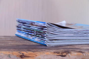 Old magazines on wooden table	