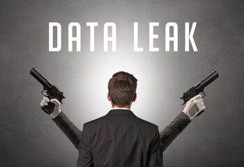 Rear view of a businessman with DATA LEAK inscription, cyber security concept