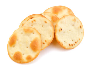A stack of cheesy rice crackers on a white background.