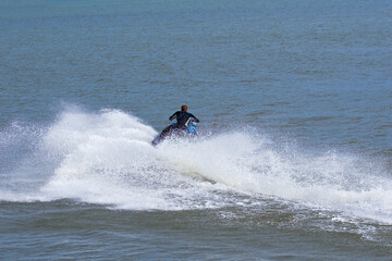 Man floating on a board on the water