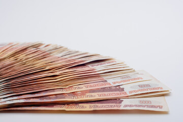 Bud of banknotes on a white background fanned out