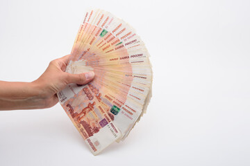 Hand fanned out the kidney of five thousandth Russian bills