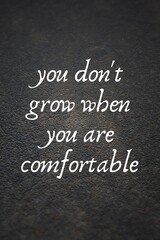 Fototapeta premium Inspirational quotes. you don't grow when you are comfortable