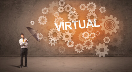 Businessman defending with umbrella from VIRTUAL inscription, technology concept