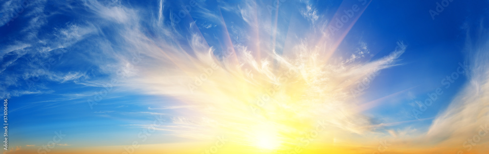 Wall mural panorama of sunset dramatic sky with bright sun